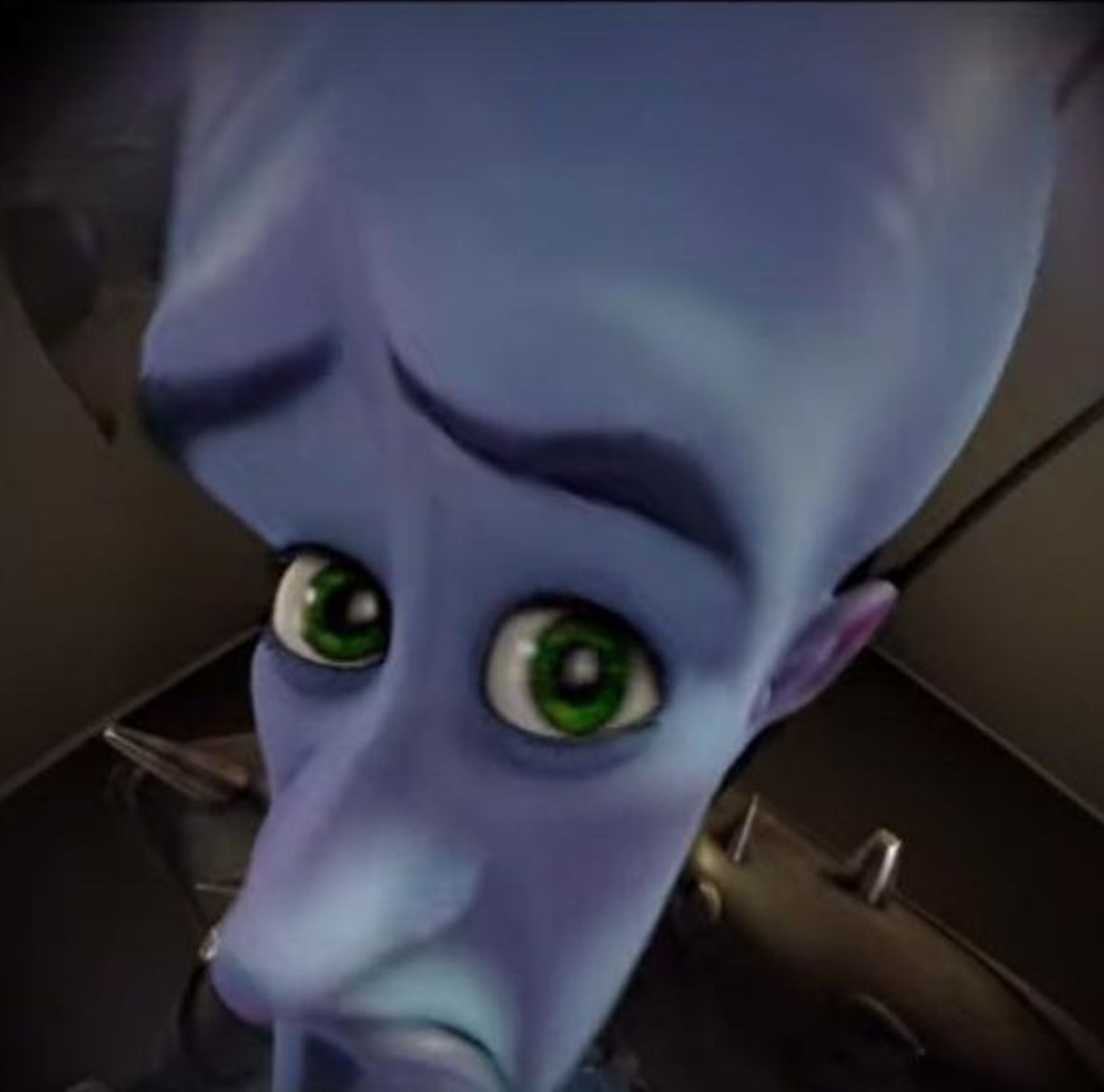 Megamind looking through door peep-hole